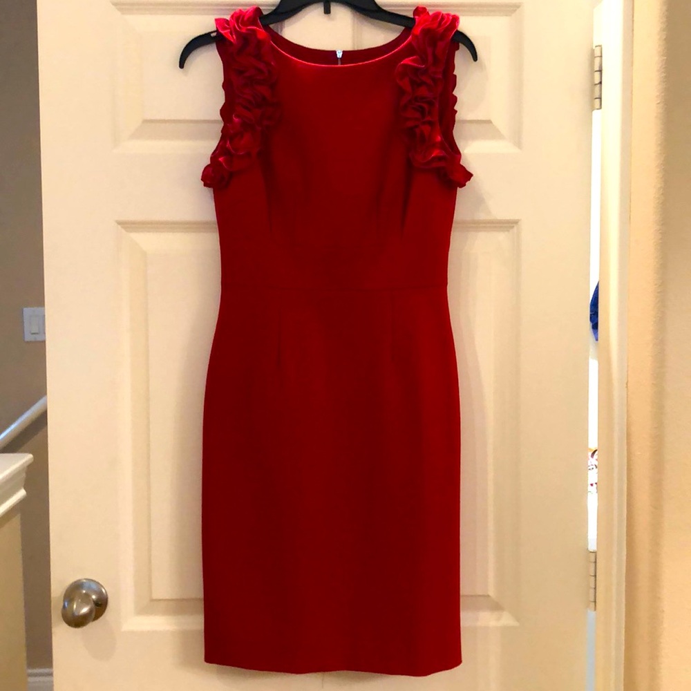 Red dress by Antonio Malani with ruffle sleeves.